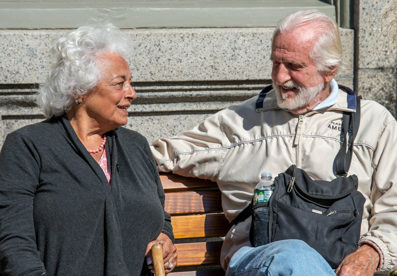 2025 World Conference a man and a woman sitting on a bench